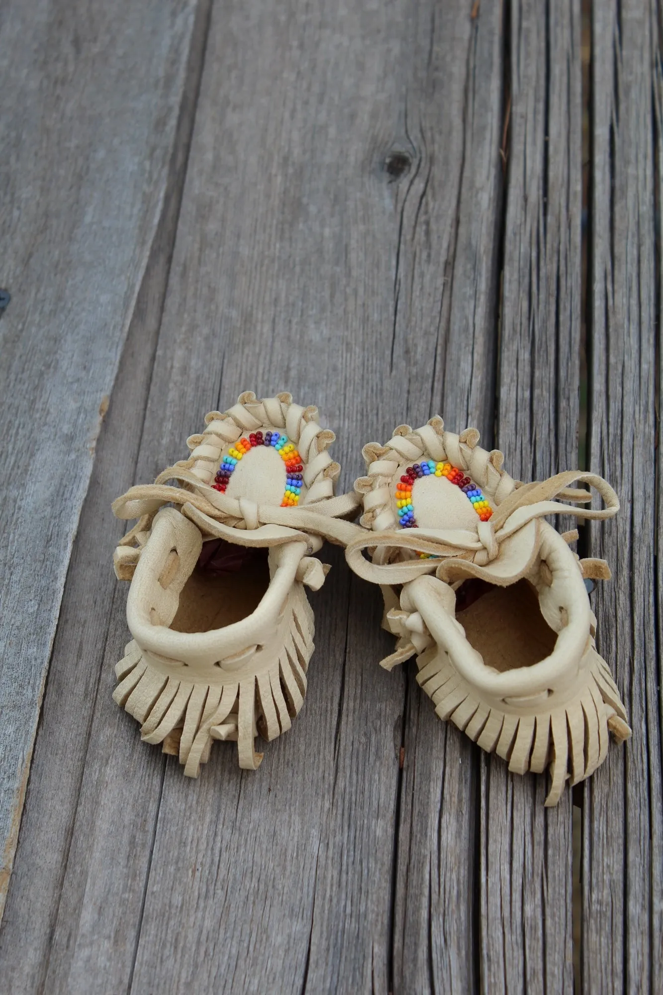 Beaded baby moccasins, fringed moccasins